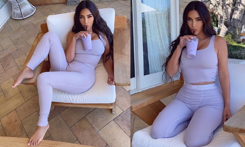Kim Kardashian chupa con una paja un batido de color lila que combina seductoramente con su ropa