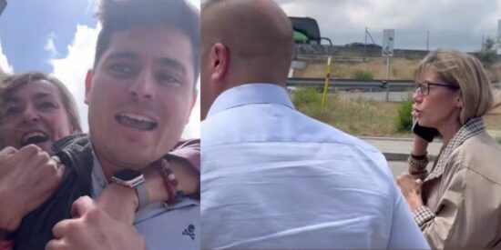 Vito Quiles, siendo retenido por una amiga de Bego&ntilde;a G&oacute;mez y esta a la derecha hablando por tel&eacute;fono.